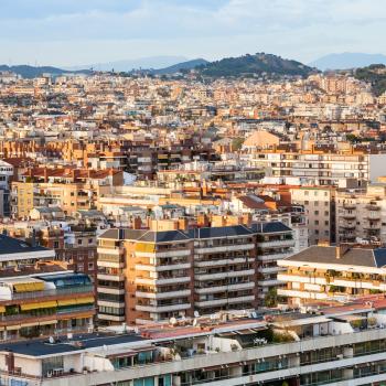 above view of residential buildings in Barcelona city on sunset