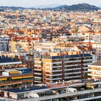 above view of apartment houses in Barcelona city on sunset