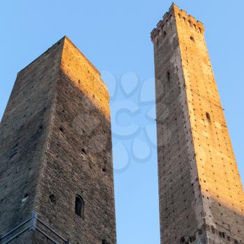 travel to Italy - medieval Two Towers (Due Torri) and blue sky in Bologna city