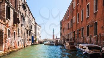 travel to Italy - Canal and bridge between shabby houses in Venice city