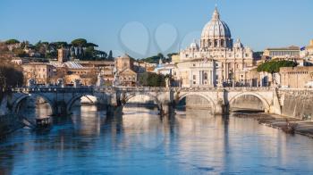 Travel to Italy - Rome cityscape with St Peter Basilica and Tiber River in sunny winter day