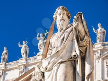 Travel to Italy - Sculpture of Apostle Paul near St Peter Basilica in Vatican city in sunny winter day. The statue of St Paul was sculpted in 1838 by Adamo Tadolini