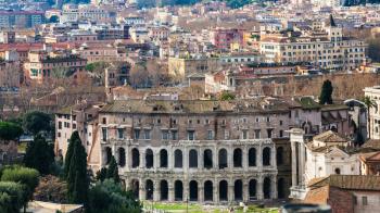 Travel to Italy - above view of Rome city with ancient Theatre of Marcellus in sunny winterday