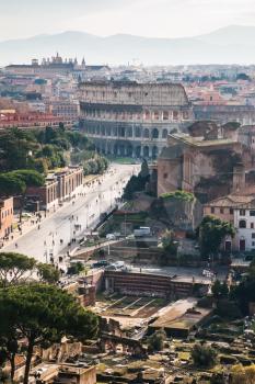 Travel to Italy - above view of Via dei Fori Imperiali and Colosseum from Capitoline Hill in Rome city in winter