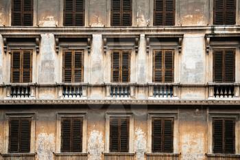 Travel to Italy - facade of old urban house in Rome city in winter
