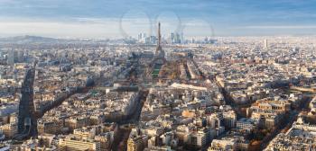 travel to France - above view of Eiffel Tower and streets in Paris city in winter twilight from Tour Maine - Montparnasse (Montparnasse Tower)