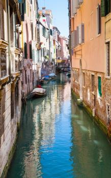 travel to Italy - narrow canal in center of Venice city in summer day