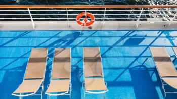 top view of empty chairs on upper deck of cruise liner