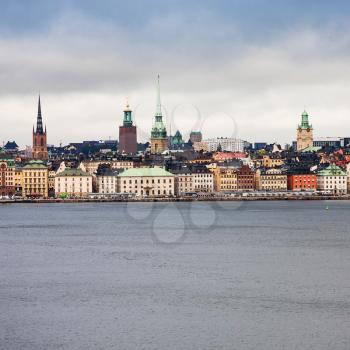 front view of center of Stockholm city (Galma Stan) from sea in cloudy autumn day
