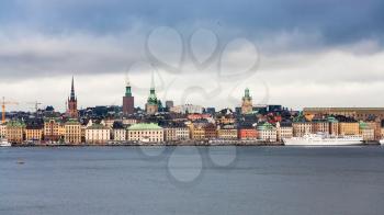 panoramic view of center of Stockholm city (Galma Stan) from sea in cloudy autumn day
