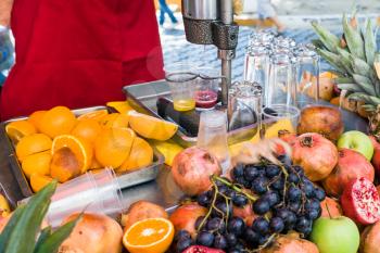 open stall with fresh fruits for preparing natural juice on street in Istanbul city
