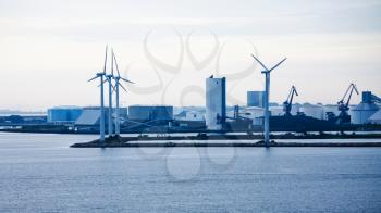 Travel to Denmark - factory buildings of offshore wind farm Middelgrunden in Oresund near Copenhagen city in Baltic Sea in blue autumn morning