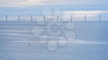 Travel to Denmark - panorama of Baltic Sea with offshore wind farm Middelgrunden in Oresund near Copenhagen city in blue autumn morning