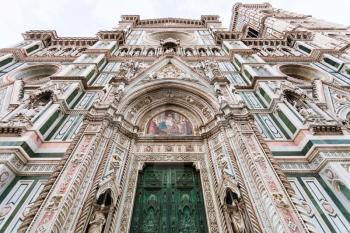 travel to Italy - closed doors of Florence Duomo Cathedral (Cattedrale Santa Maria del Fiore, Duomo di Firenze, Cathedral of Saint Mary of the Flowers) and Giotto's Campanile in morning