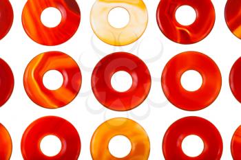 lot of polished donut shape agate gemstone circles isolated on white background