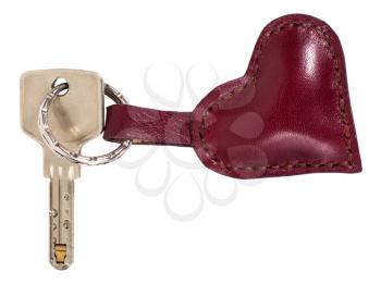 modern key with red leather heart shape keychain isolated on white background