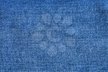 textile background - blue texture of denim fabric close up