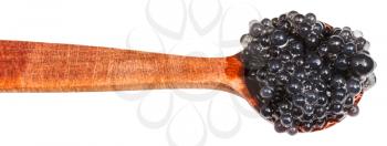 salty black dyed caviare of halibut fish in wood spoon isolated on white background