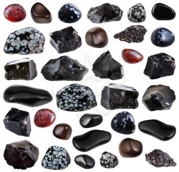 collection of various tumbled and raw obsidian (volcanic glass) mineral stones isolated on white background