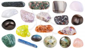 collection of various polished mineral stones - petalite, castorite, kyanite, charoite, tinaksite, lizardite, hornblende, amphibole, jet, cancrinite, ussingite, obsidian, natrolite, mesolite, etc