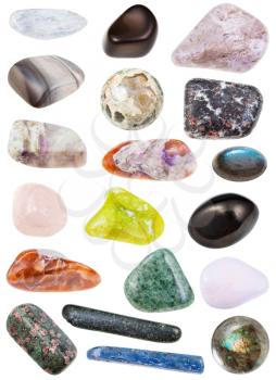 collection of various tumbled mineral stones - labradorite, tholeiite, tholeite, eclogite, rhyolite, jadeite, morganite, petalite, castorite, kyanite, charoite, tinaksite, lizardite, hornblende, etc