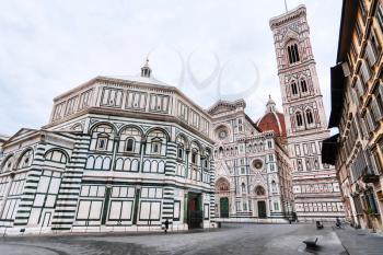 travel to Italy - view of Piazza San Giovanni with Baptistery (Battistero di San Giovanni, Baptistery of Saint John) and Cathedral Santa Maria del Fiore with Giotto's Campanile in Florence in morning