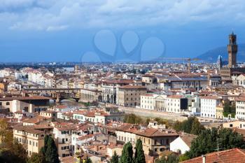 travel to Italy - above view of Florence city with Ponte Vecchio and Palazzo Vecchio from Piazzale Michelangelo