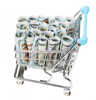 supermarket trolley with rolls from dollar banknotes isolated on white background