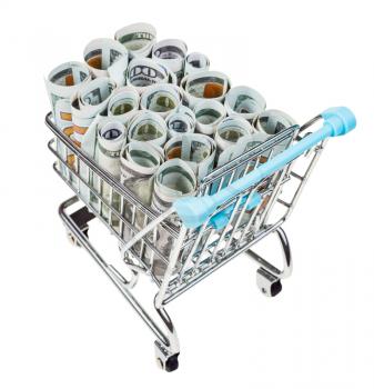 shopping trolley with rolls from dollar banknotes isolated on white background