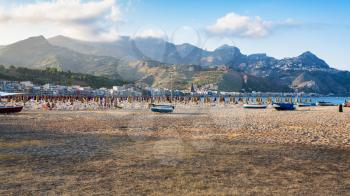 travel to Italy - sand beach in Giardini Naxos town in Sicily in summer evening
