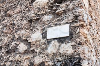 travel to Italy - blank marble plate on outdoor stone wall of medieval cathedral in Monreale town, Sicily