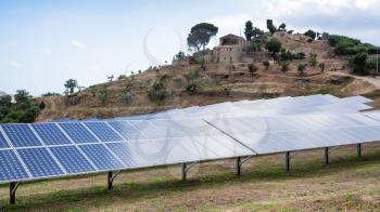 travel to Italy - solar batteries near village in Sicily