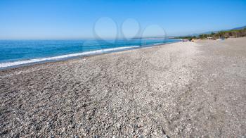 travel to Italy - black pebble and sand beach San Marco on Ionian Sea coast in Sicily