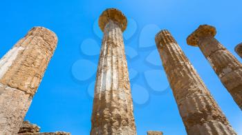 travel to Italy - blue sky and Dorian columns of ancient Temple of Heracles (Tempio di eracle) in Valley of the Temples in Agrigento, Sicily