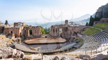 travel to Italy - view of ancient Teatro Greco (Greek Theatre) in Taormina city in Sicily