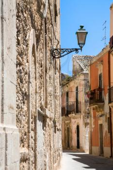 travel to Italy - old houses on narrow street in Syracuse city in Sicily