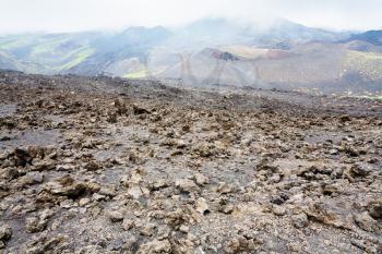 travel to Italy - hardened lava field on Mount Etna in Sicily in summer day