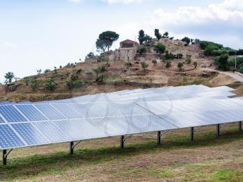 travel to Italy - solar panels near village in Sicily