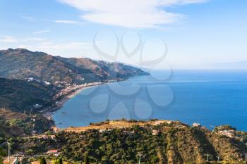 travel to Italy - view of Letojanni resort and coast of Ionian sea from Taormina city in Sicily in summer twilight