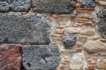 travel to Italy - detail of stone wall of ancient castle in Calatabiano town in Sicily