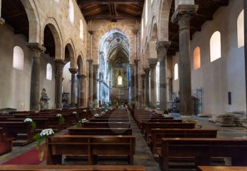 CEFALU, ITALY - JUNE 25, 2011: interior of Duomo di Cefalu in Sicily. Cathedral - Basilica of Cefalu was erected in 1131 in the Norman architectural style