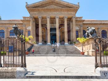 PALERMO, ITALY - JUNE 24, 2011: visitors near entrance of Teatro Massimo Vittorio Emanuele. It is the biggest in Italy opera house and opera company located on the Piazza Verdi in Palermo