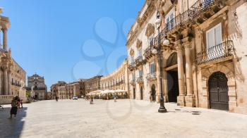 SYRACUSE, ITALY - JULY 3, 2011: people on piazza Duomo in Syracuse city in Sicily. The city is a historic town in Sicily, the capital of the province of Syracuse.