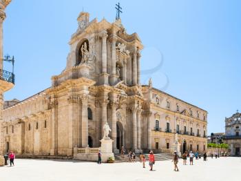 SYRACUSE, ITALY - JULY 3, 2011: people near Cathedral on piazza Duomo in Syracuse city in Sicily. The city is a historic town in Sicily, the capital of the province of Syracuse.