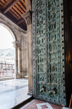 MONREALE, ITALY - JUNE 25, 2011: entrance of Duomo di Monreale in Sicily. The cathedral of Monreale is one of the greatest examples of Norman architecture, it was begun in 1174