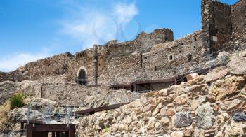 CALATABIANO, ITALY - JULY 5, 2011: people near ancient arabic - norman - byzantine castle in Sicily. Calatabiano Castle was founded by the Arabs, who moved from Calatabiano to conquer Taormina in 902