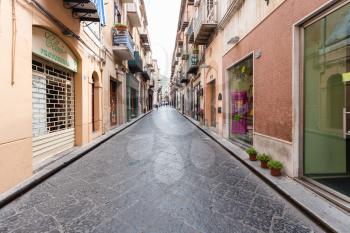 CEFALU, ITALY - JUNE 25, 2011: Corso Ruggero street in Cefalu in Sicily. The town is one of the major tourist attractions in the Palermo - Messina region, every year it attracts millions of tourists