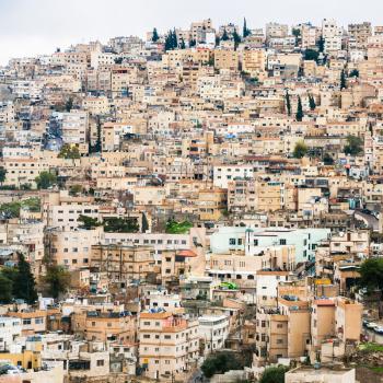 Travel to Middle East country Kingdom of Jordan - view of urban houses in Amman city from citadel in winter