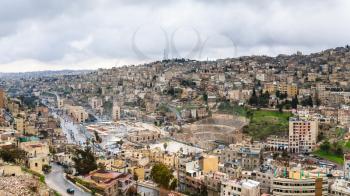Travel to Middle East country Kingdom of Jordan - view of center of Amman city from citadel in winter