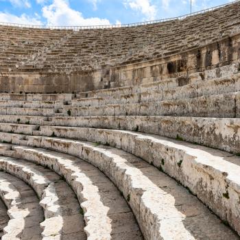 Travel to Middle East country Kingdom of Jordan - stone beches of roman Large South Theatre in Jerash (ancient Gerasa) town in winter